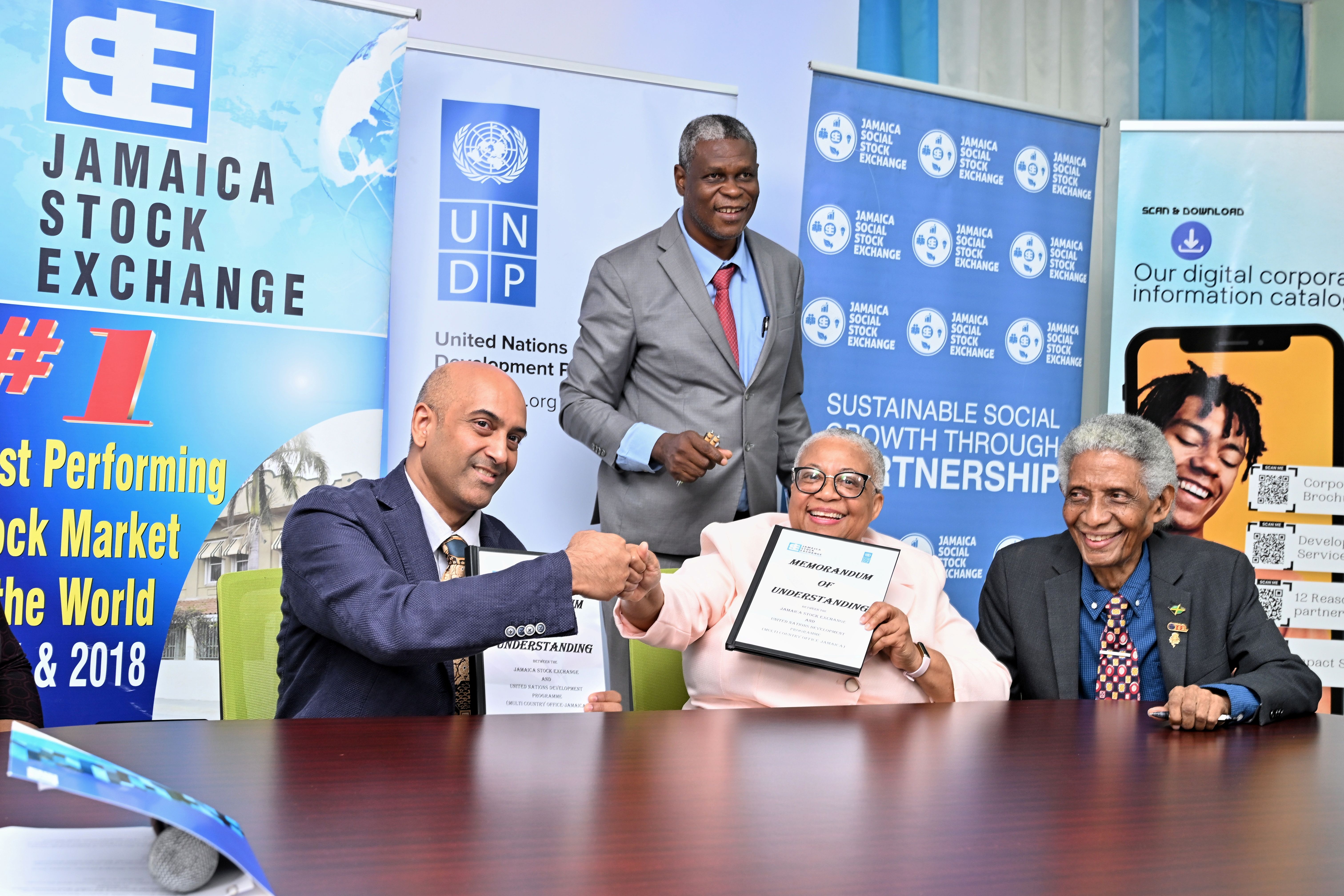Handshake at the signing of a MOU between UNPD and Jamaica Stock Exchange