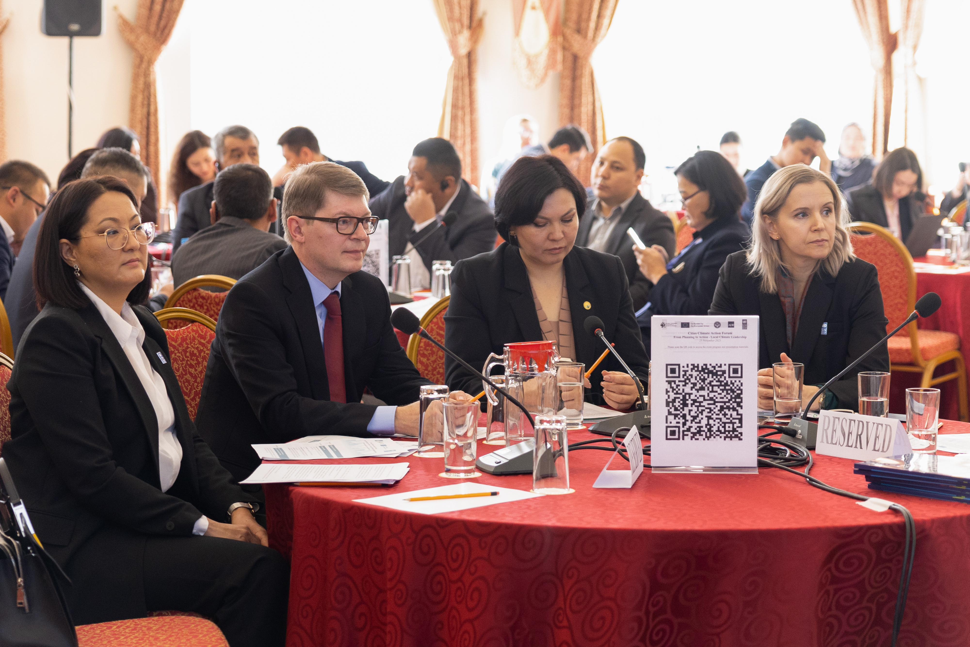 Key speakers at a conference on Cities Climate Action