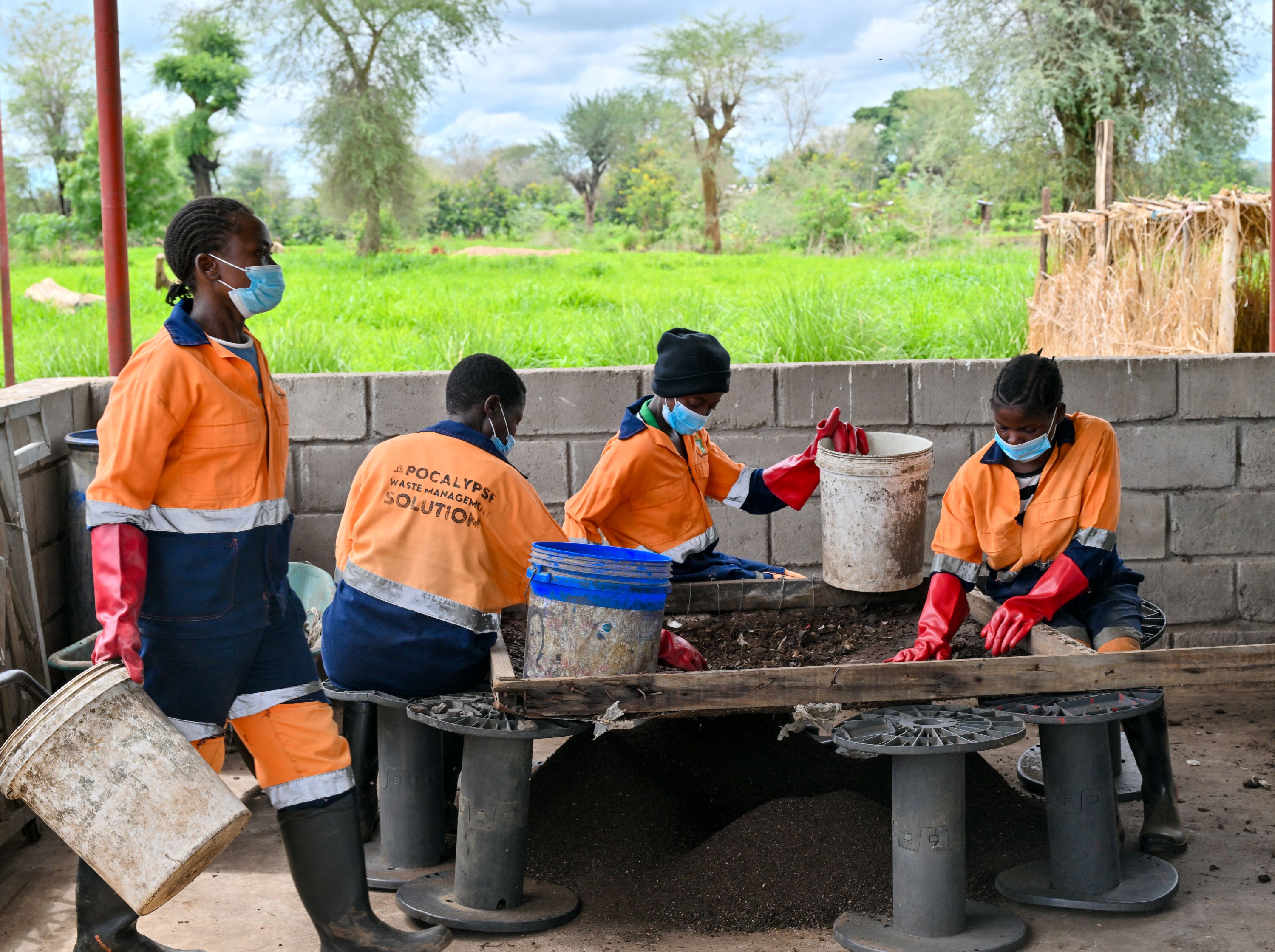 Workers at APOWAMAS sorting and processing waste, contributing to cleaner communities while creating inclusive green jobs.