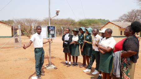 Form 3 students at Mutema High School explain the functions of the Automated Weather Station installed at their school