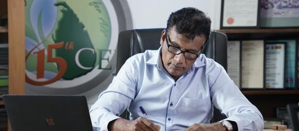Mr Hemantha Withanage at his desk