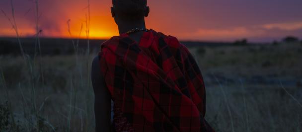 A man looks towards the horizon in the Nashulai Maasai Conservancy