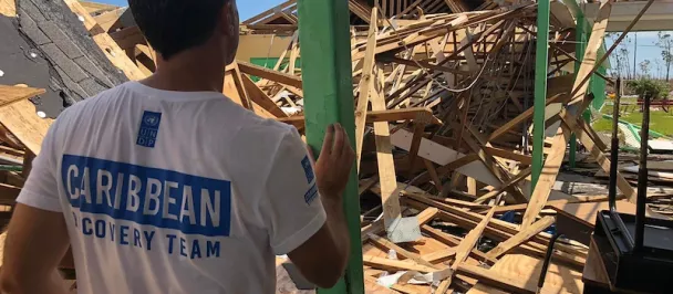 UNDP staff member surveys storm damage