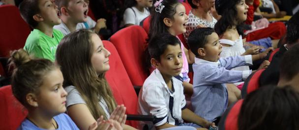 Children in the audience of a theatre show