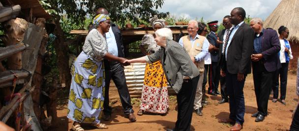 US Secretary of Treasury, Dr. Janet Yellen, greets a SCRALA project beneficiary at her homestead in Chongwe, Zambia