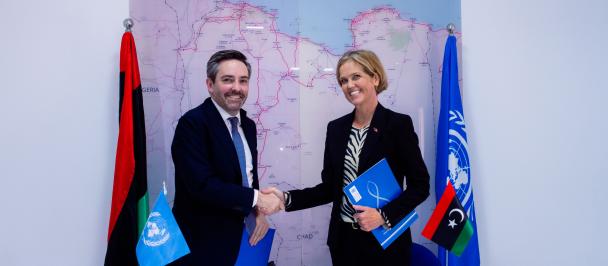 Resident Representative for Libya Marc-Andre Franche shaking hands with Norway Ambassador to Libya H.E Hilde Klemetsdal during signing ceremony