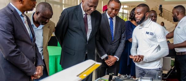 An image of Honourable Minister of Technology and Science, Felix Mutati (centre) flanked by other dignitaries, on his immediate left is the UNDP Assistant Resident Representative, Gregory Saili during the tour of Innovation Stands at the 2022 Innovation Award Ceremony, held at Government Complex.