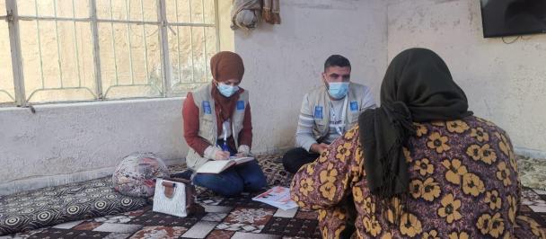 UNDP mental health workers interviewing a woman in Iraq.