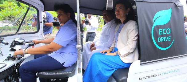 Min. of Transport and Highways & UNDP RR on a short ride in a converted e-tuk driven by a female driver