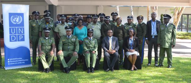 Resident Representative, James Wakiaga and the Project Coordinator for the GRZ-UN joint Programme on GBV joined by police officials