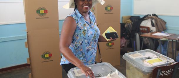 Woman voting, smiling