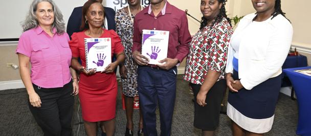 Persons with disabilities collect communications materials on the latest gender based violence legislation
