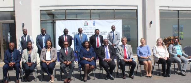 An image of Hon. Mulambo Haimbe, SC, MP, Mr. James Wakiaga, UNDP Resident Representative, Mrs Mwangala Zaloumis, ECZ Chairperson and Mr. Claudia Bacigalupi-EU Head of Cooperation pose for a picture with officials and participants after the launch of the IAWG at Legacy in Chongwe