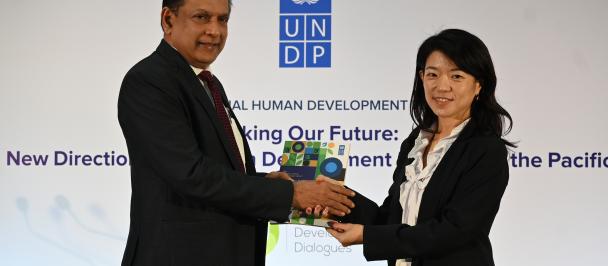Ms Azusa Kubota, Resident Representative, UNDP in Sri Lanka officially hands over a copy of the Regional Human Development Report