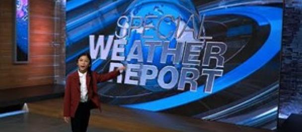 girl forecasting weather on news