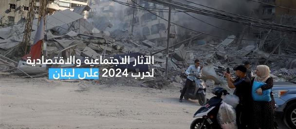People stand near a damaged building with smoke rising and debris scattered.