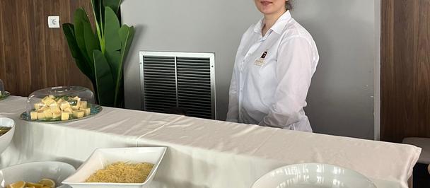 Vera now works as a Buffet Attendant, bringing professionalism and care to every guest interaction.
