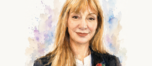 Portrait of a blonde woman in a dark blazer with a medal, watercolor splash background.