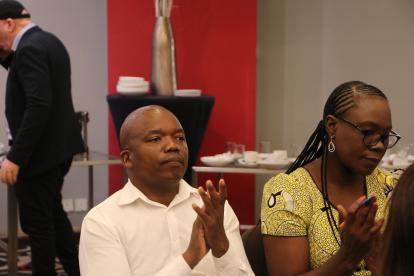 Attendees at the ZAPD Strategic Plan Launch - a man and a woman clapping