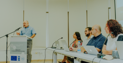 a group of people sitting at a desk