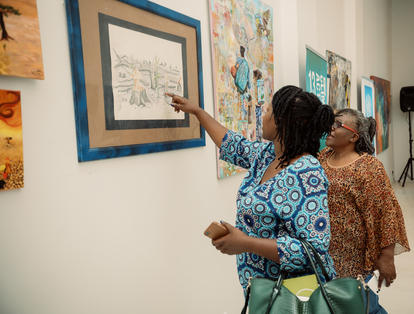 two women looking at art