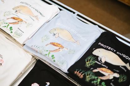 Row of pastel snack bags with animal illustrations on a store shelf.