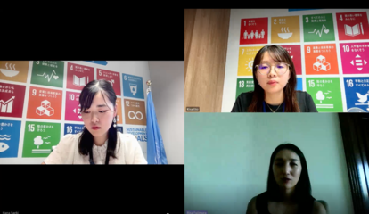 Four-person video conference; two speakers sit in front of colorful SDG goal posters.