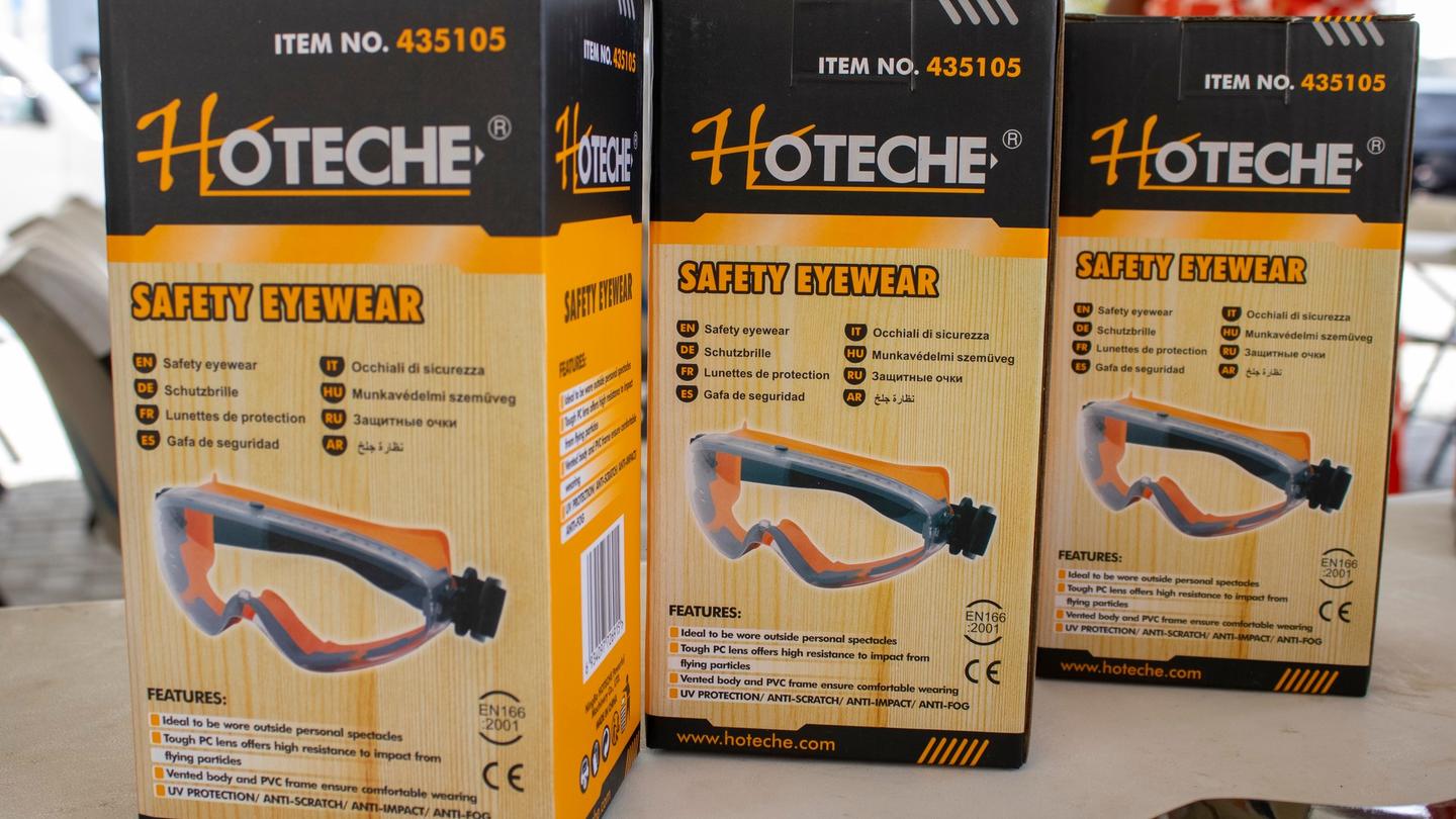 Three orange and black boxes on a shelf, each showing a blue curved tool illustration.