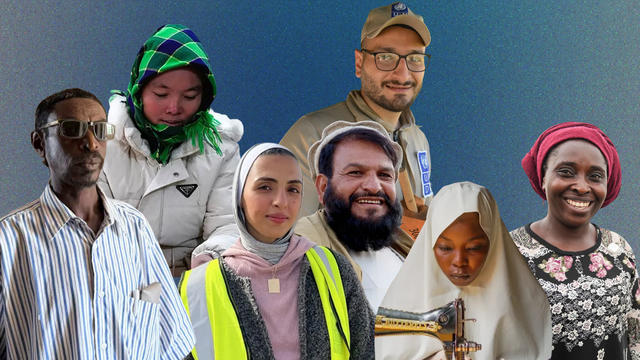 Diverse group posing together against a blue backdrop; one person wears a safety vest.