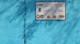An image of the plaque outside the school that reads &quot;These school road safety improvements have been made possible by technical support from UNDP Zambia in partnership with Zambia Road Safety Trust and with funding support from the UNRSF&quot;