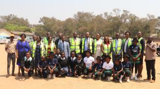 The members of the high table with students from Jacaranda Combined Schoolat the Launch of Safe Schools Infrastructural Improvements in Lusaka