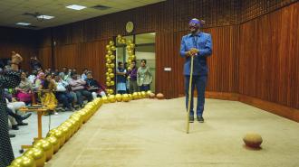 UNDP Bangladesh sitting in audience with man on stage