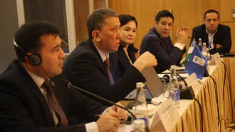 Photograph of a panel discussion with education experts and UNDP project at a conference table.