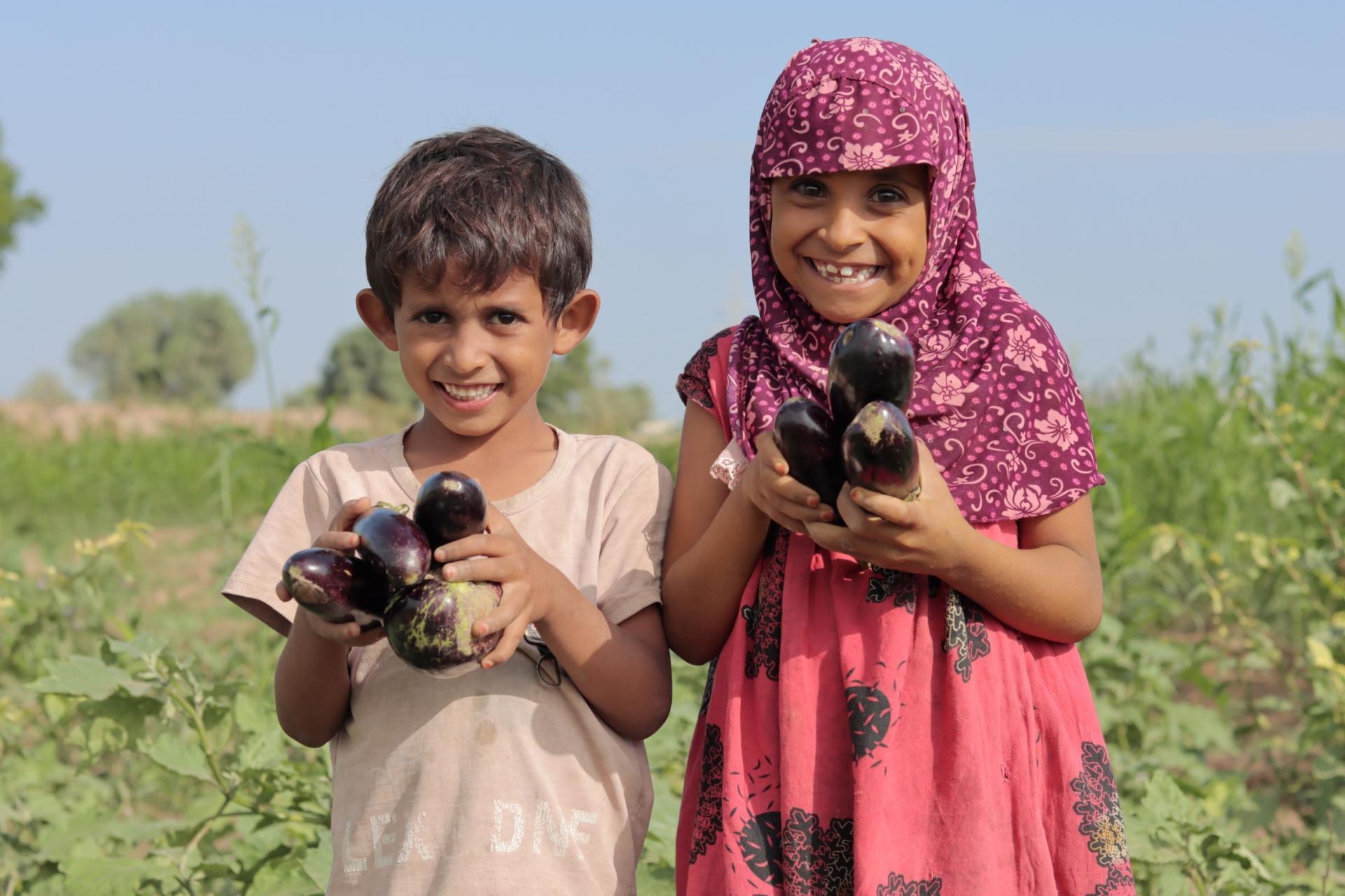 Kids with eggplant
