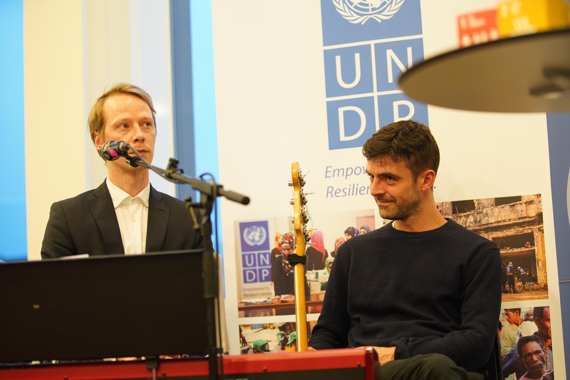 Two men talking at conference