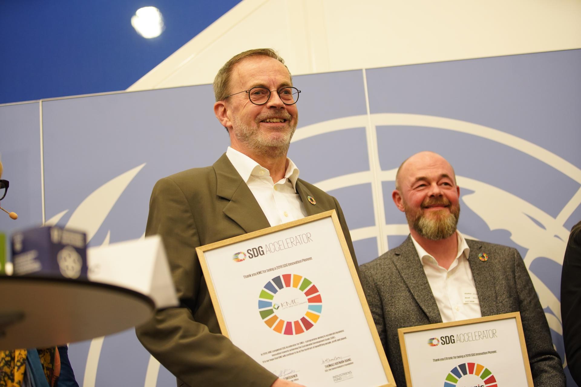 Men receiving an award
