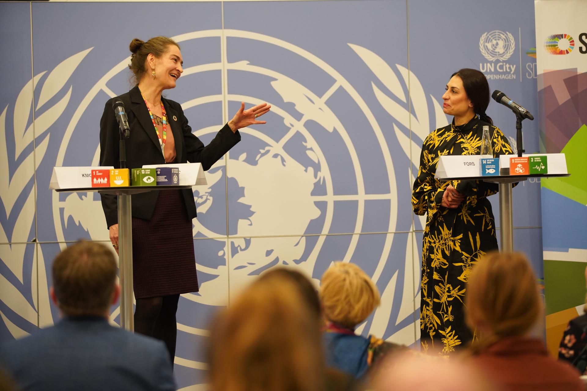 women speaking on stage