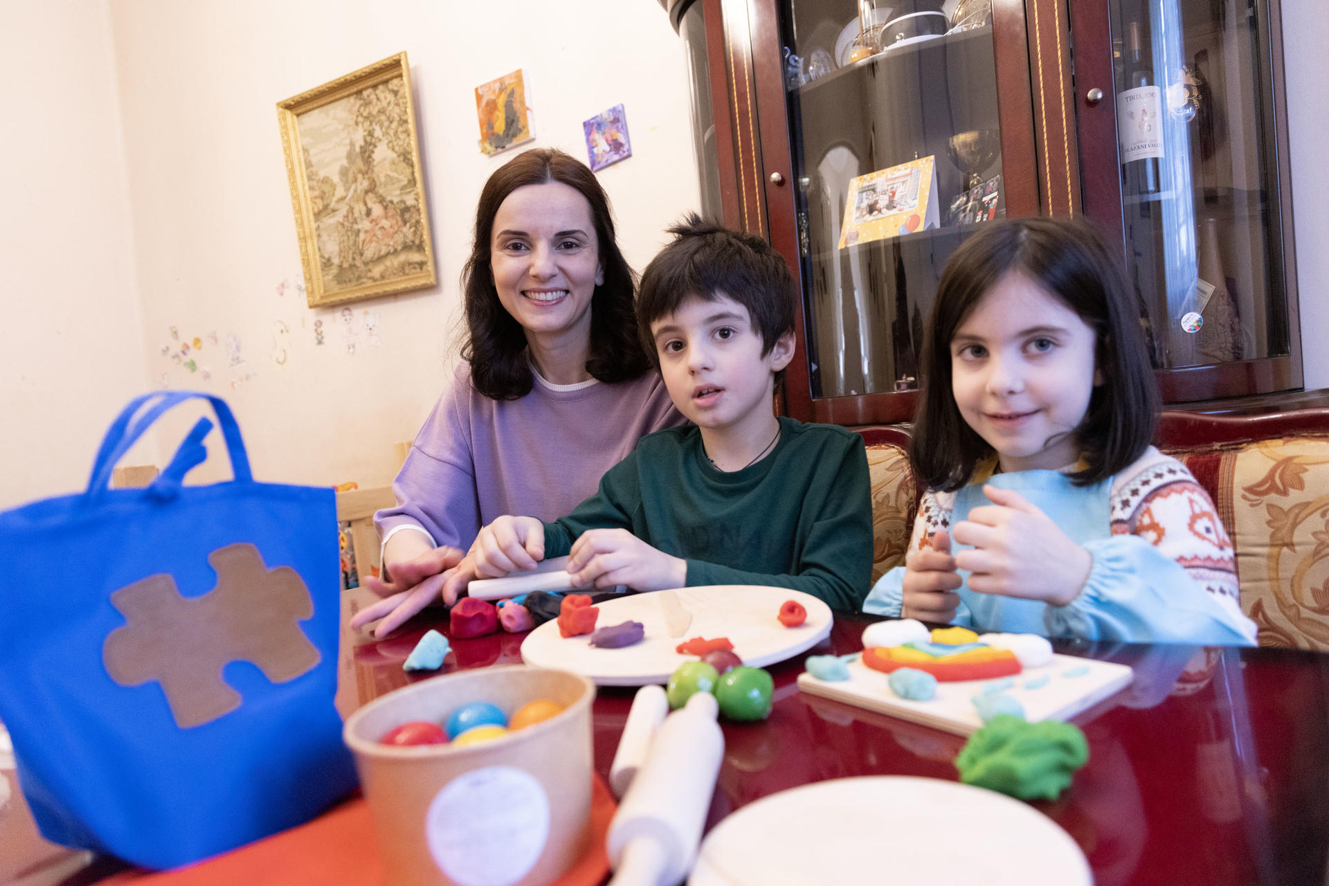 Madona, Beso and Liza molding the playdough