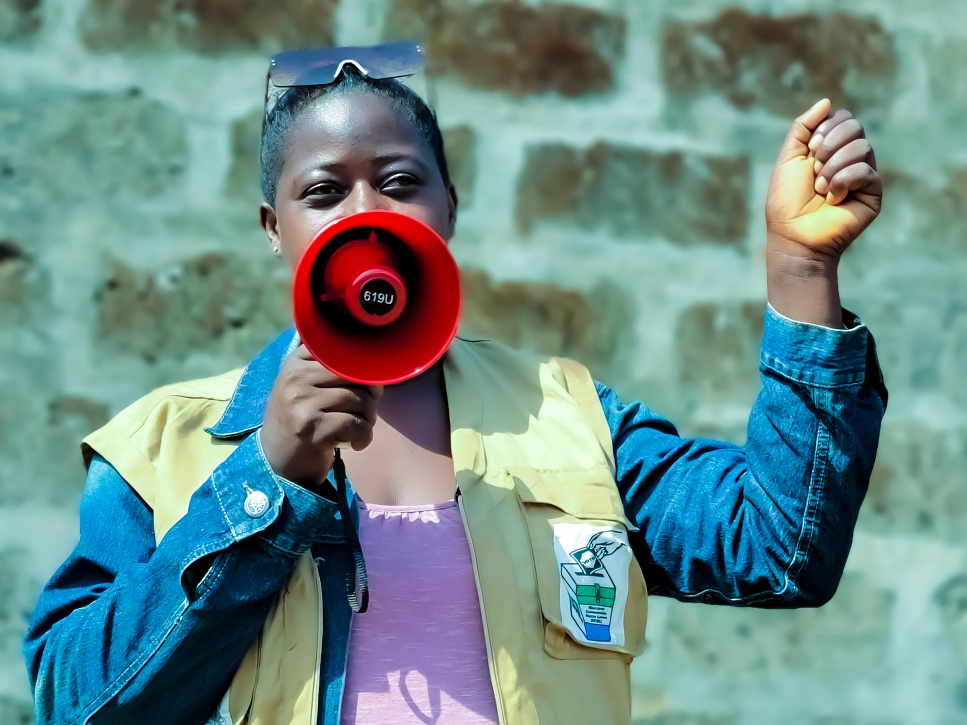 woman talking through a speaker