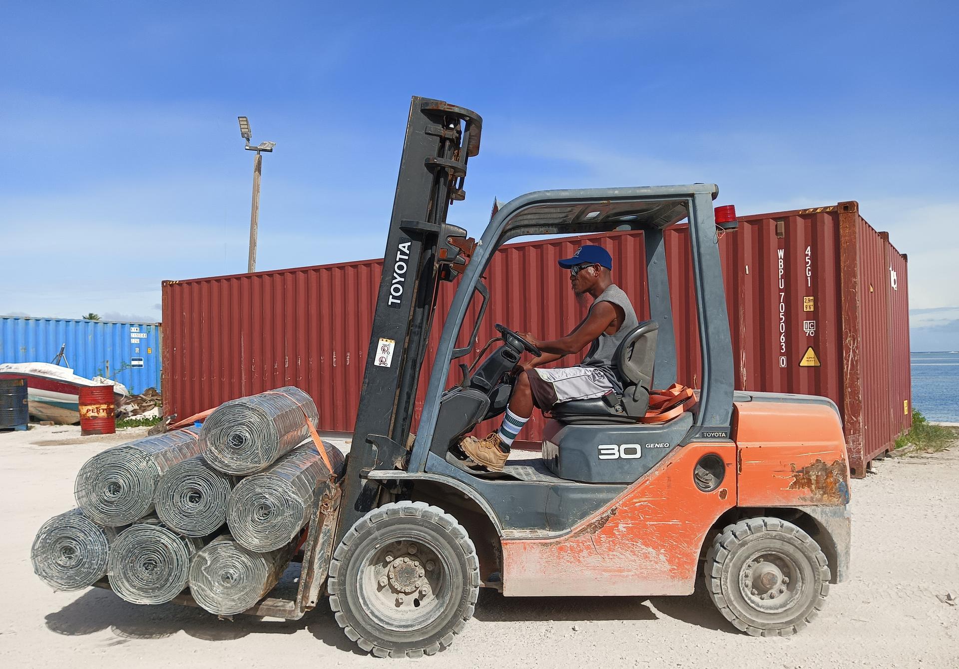Transporting construction materials to warehouse at Ebeye