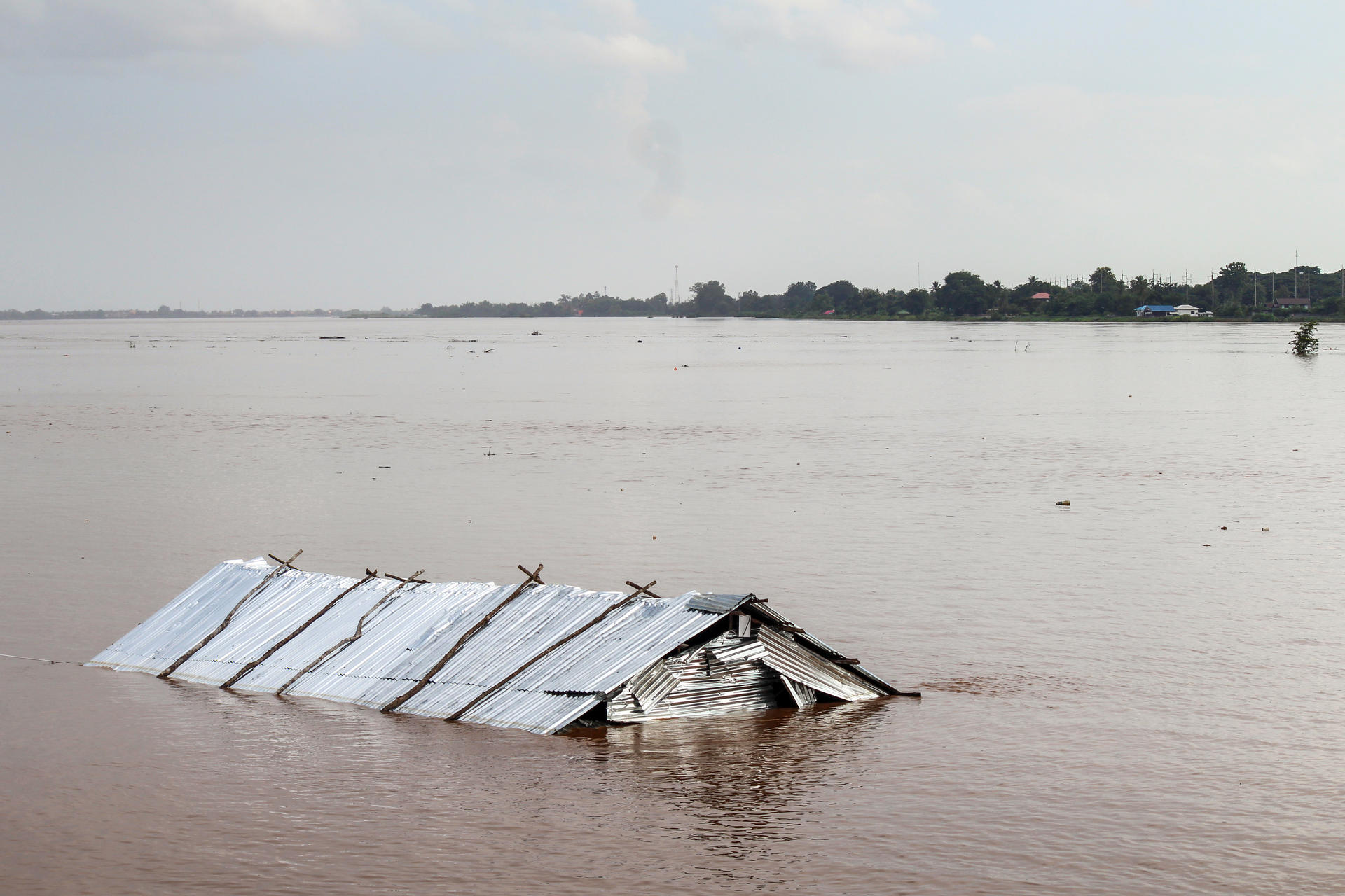 a house roof under the water