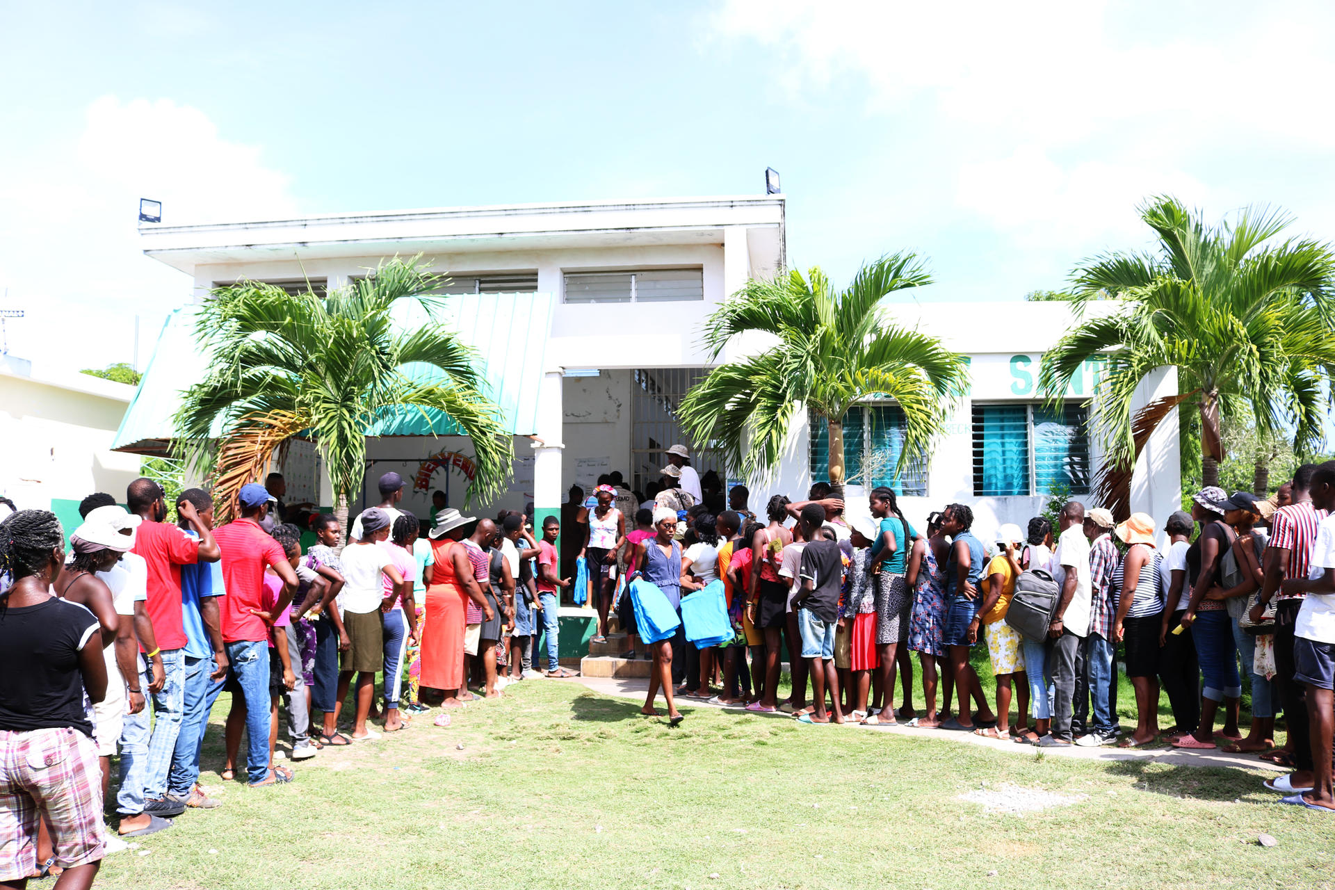Group of people gathered outside building