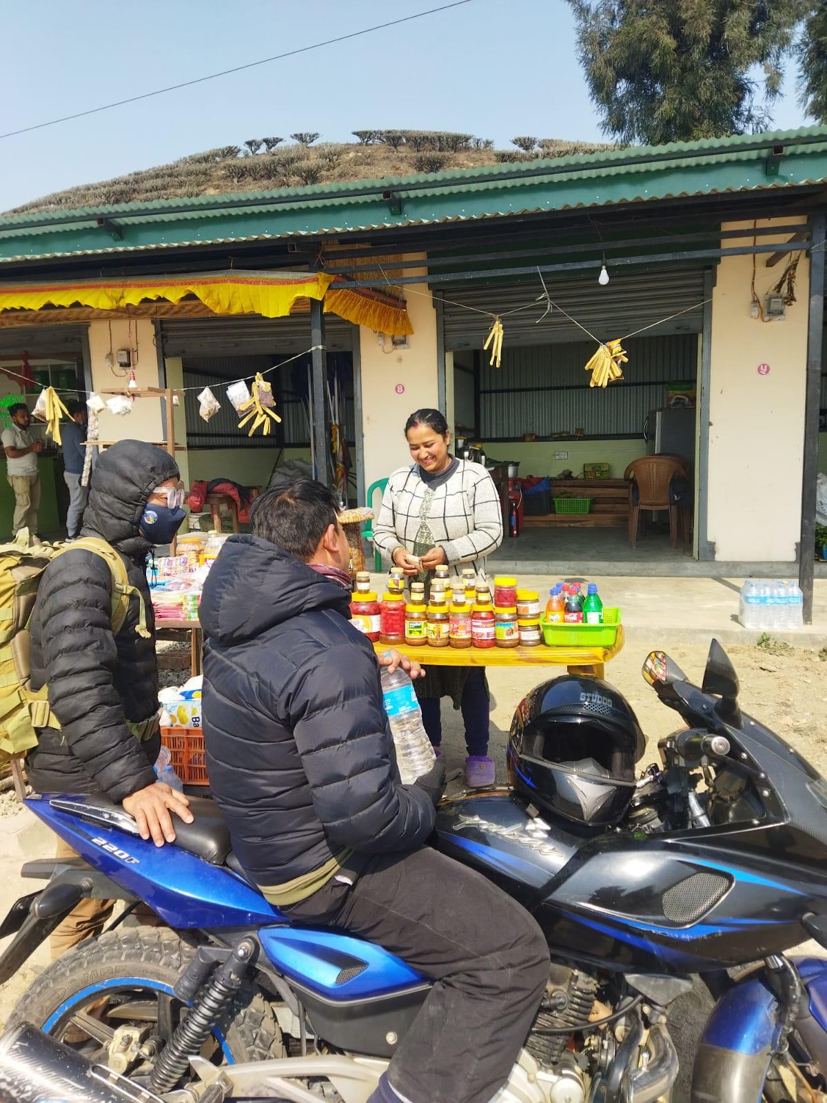 a lady selling local products in a subsidized market