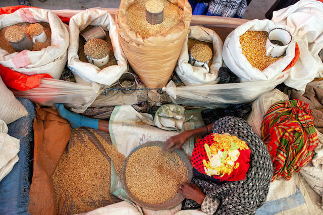 Woman sellling grains in market