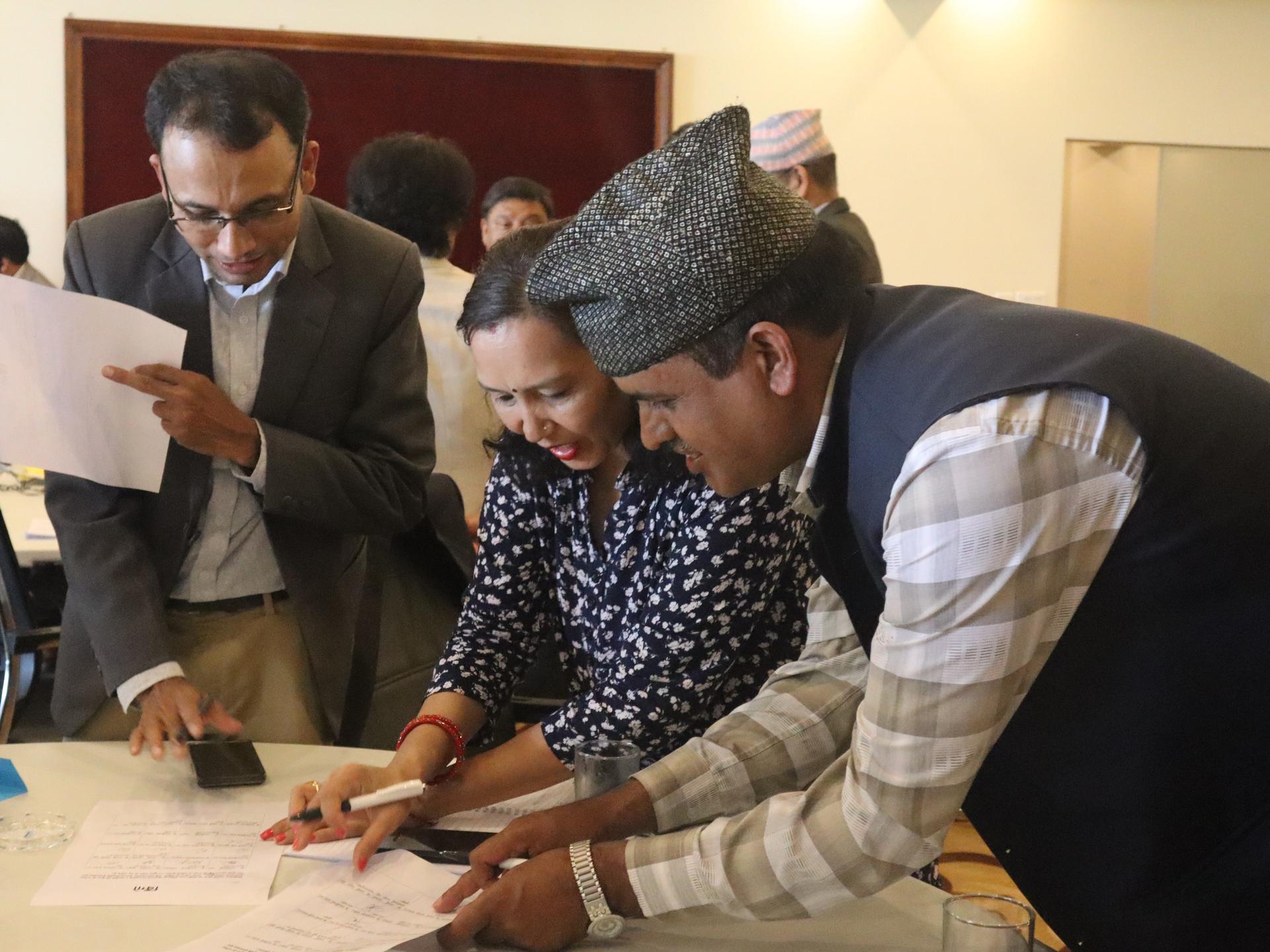 people discussing an issue together as a team