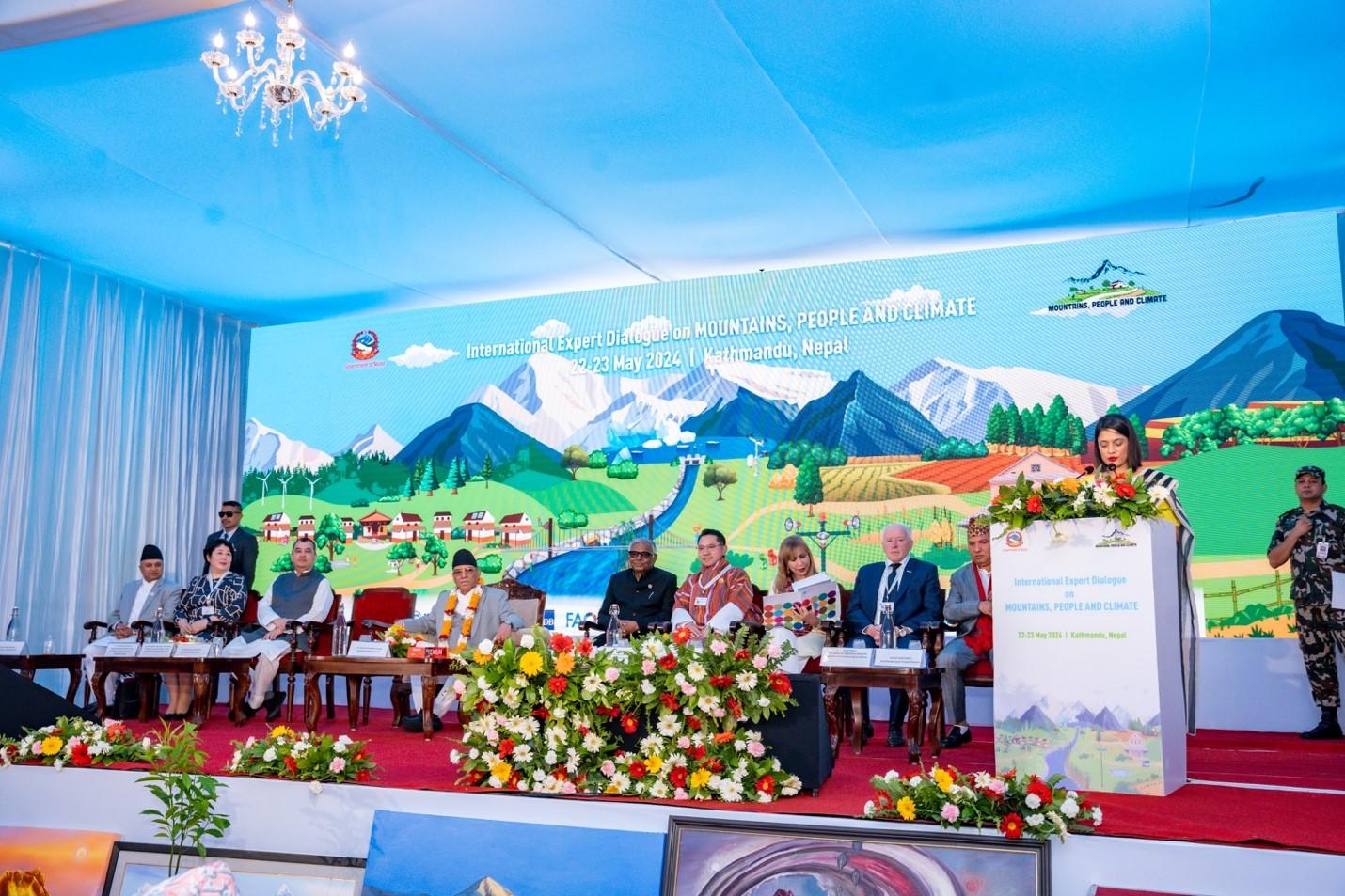 a picture of a lady speaking at a climate