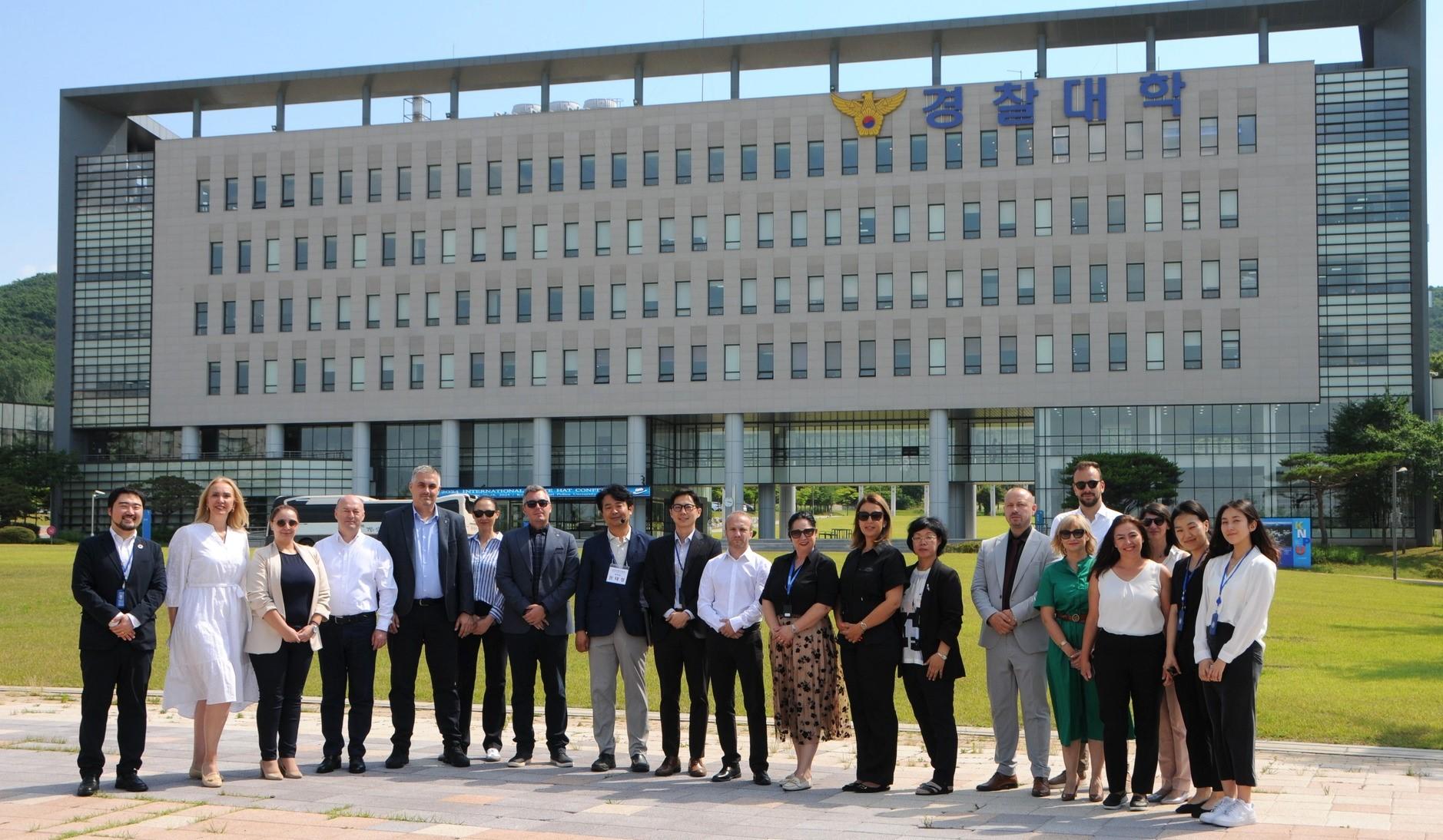 a group of people standing in front of a building
