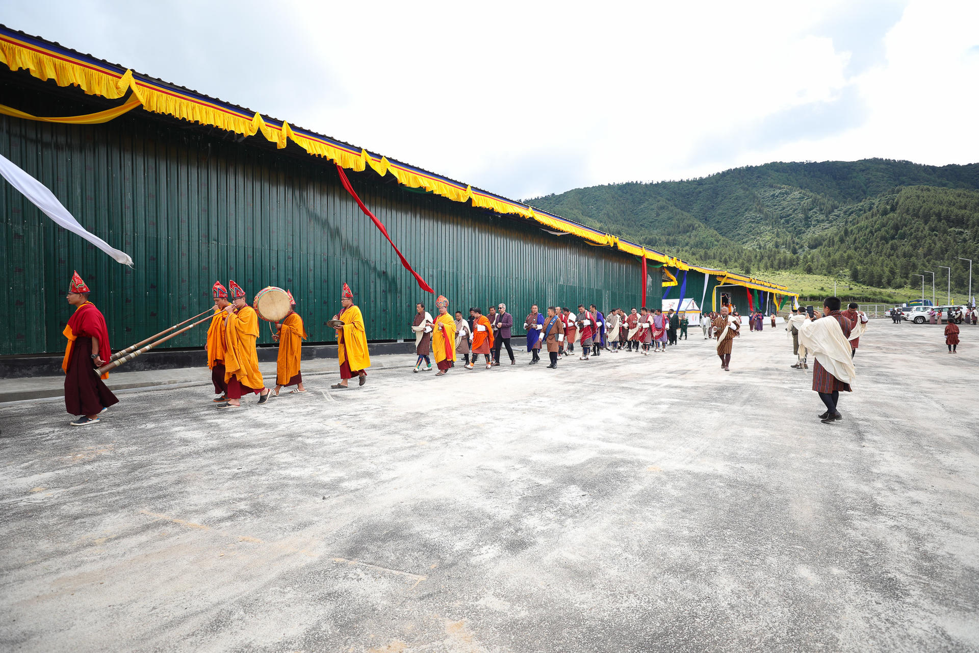 a group of people walking on a bridge