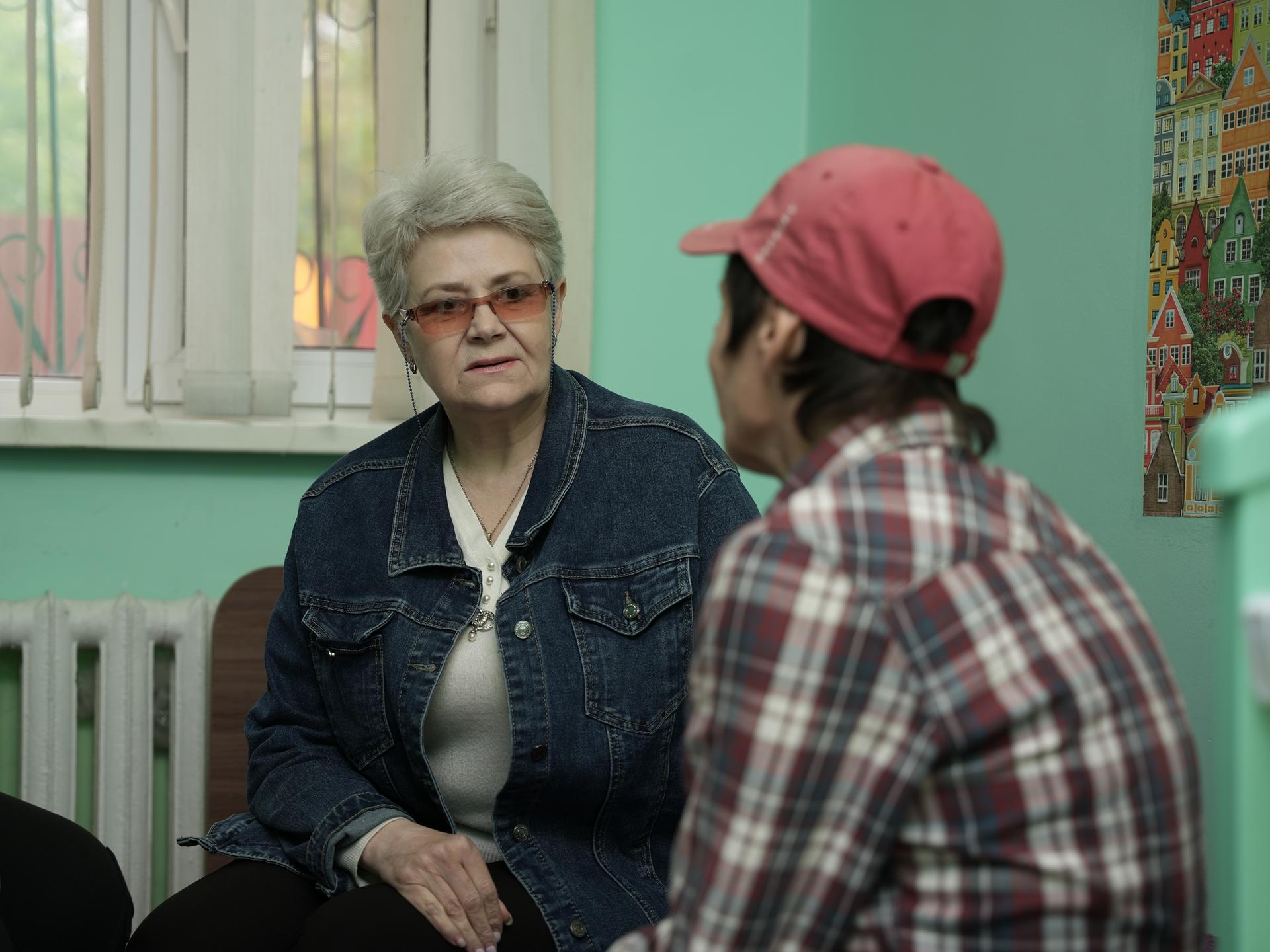 a man and a woman looking at the camera