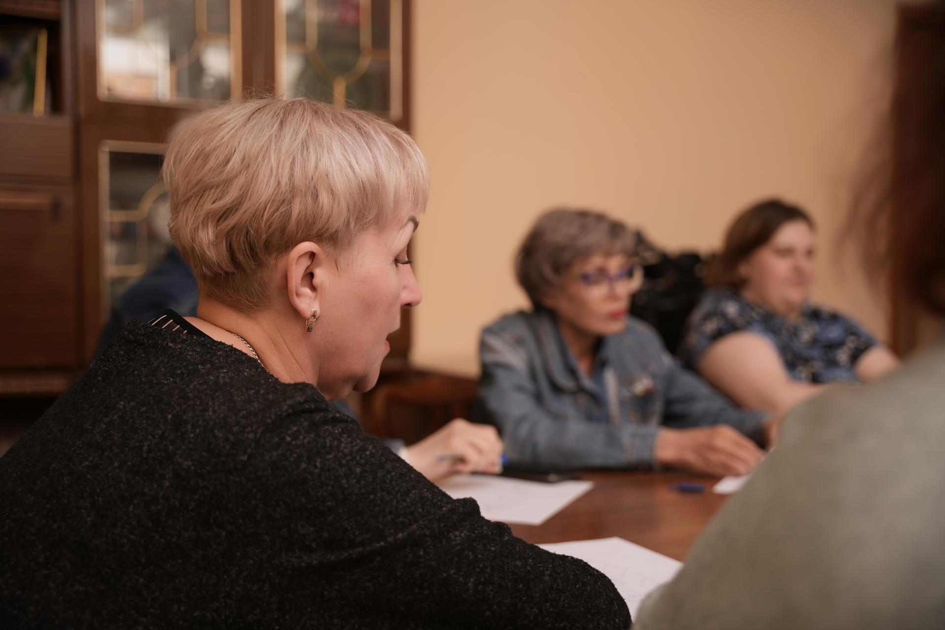 a group of people sitting at a table